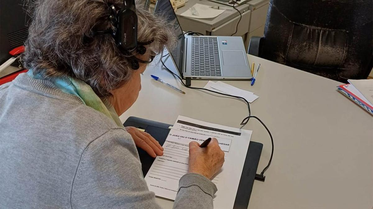 A participant in the study writes using a pen that is being digitized. (Ana Rita Silva via SWNS). 
