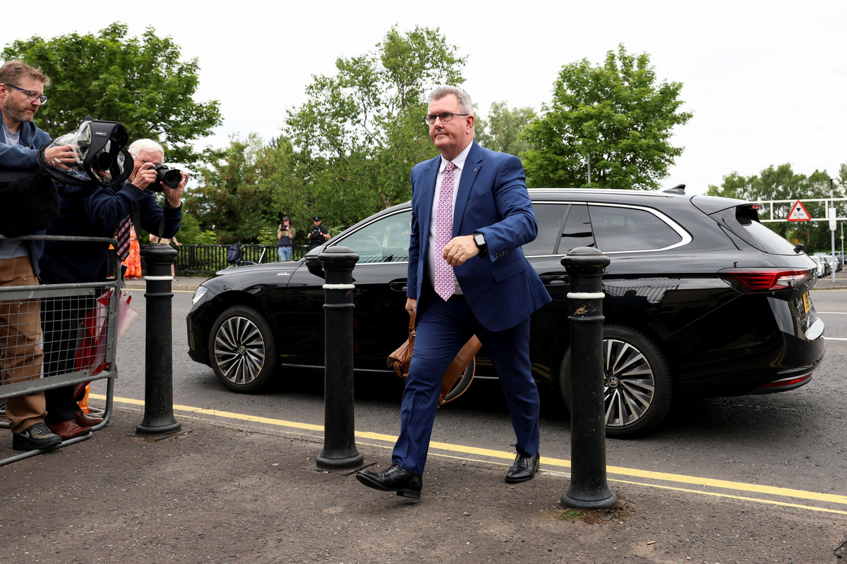Jeffrey Donaldson, former leader of the Democratic Unionist Party (DUP), charged with historical sex offences, walks outside the Newry Courthouse as his trial continues, in Newry, Northern Ireland, June 22, 2026. REUTERS/Cathal McNaughton