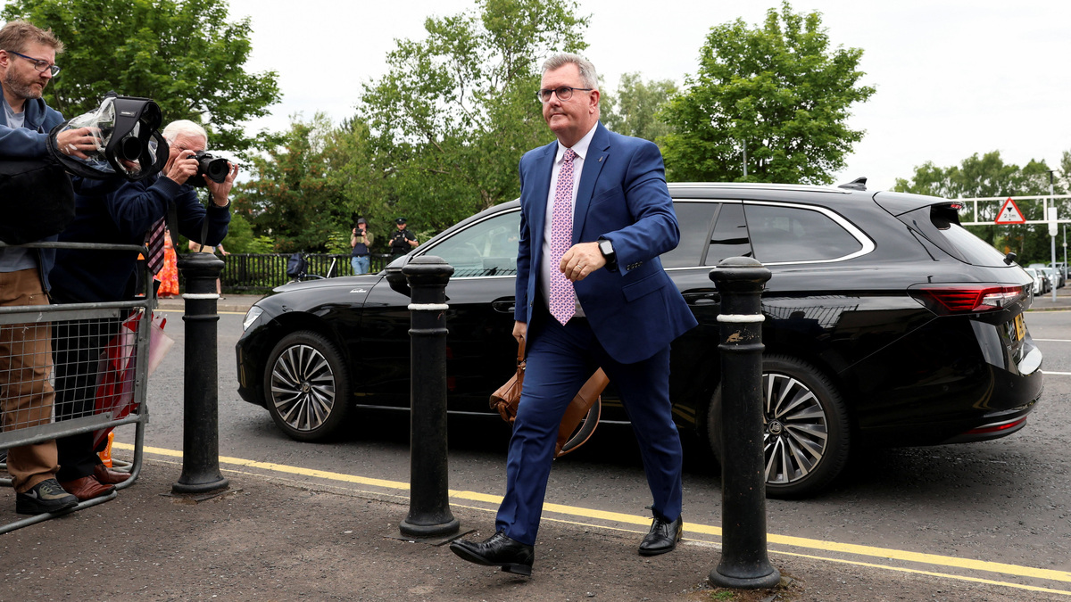 Jeffrey Donaldson, former leader of the Democratic Unionist Party (DUP), charged with historical sex offences, walks outside the Newry Courthouse as his trial continues, in Newry, Northern Ireland, June 22, 2026. REUTERS/Cathal McNaughton