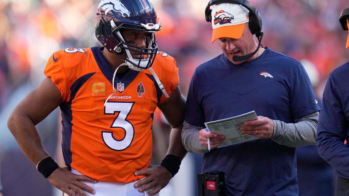 Denver Broncos quarterback Russell Wilson (3) talks with head coach Nathaniel Hackett during the second half of an NFL football game against the Houston Texans, Sunday, Sept. 18, 2022, in Denver. (AP Photo/Jack Dempsey)