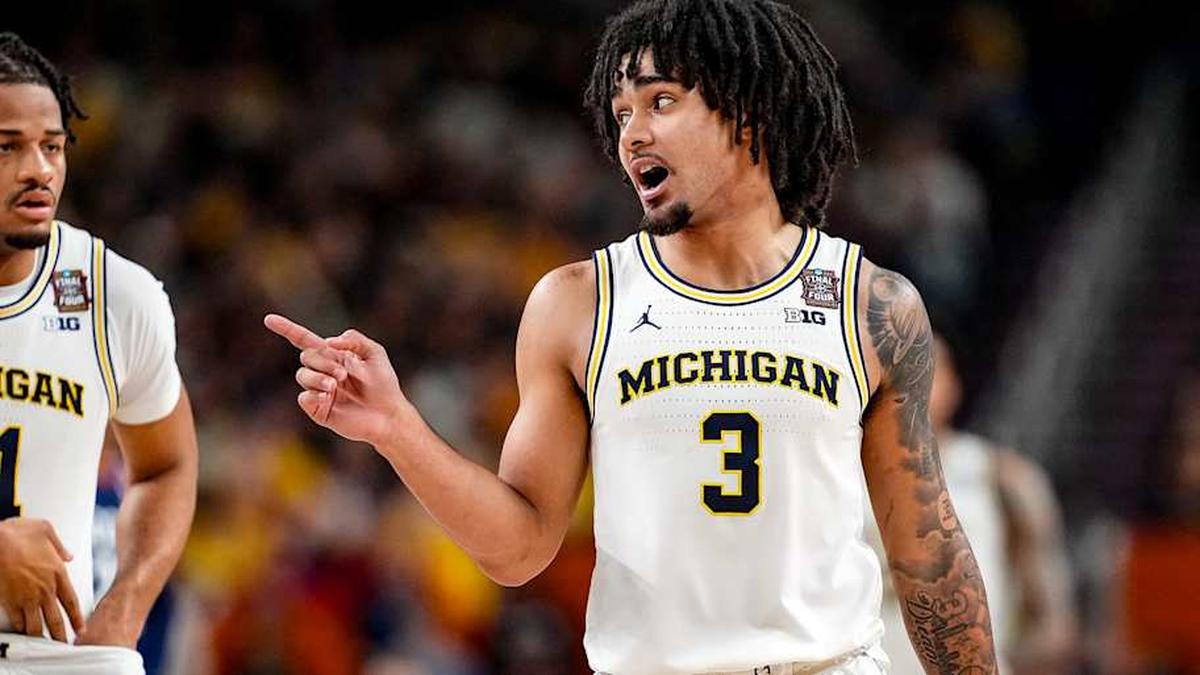  Elliot Cadeau was Michigan's leading scorer in the national championship against UConn. | Erick W. Rasco/Sports Illustrated 