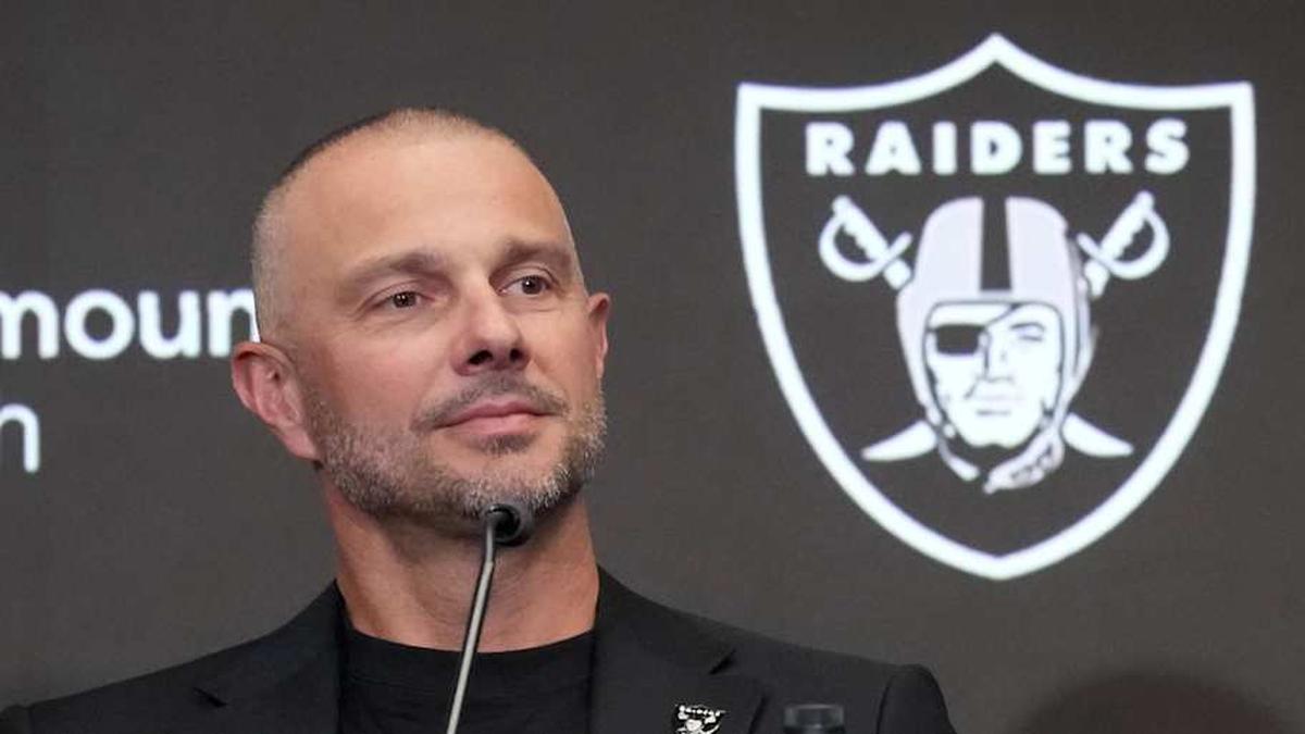  Apr 24, 2026; Henderson, NV, USA; Las Vegas Raiders quarterback Fernando Mendoza (center) speaks at introductory press conference at Intermountain Health Performance Center flanked by general manager John Spytek (left) and head coach Klint Kubiak after being selected as the No. 1 pick in the 2026 NFL Draft. Mandatory Credit: Kirby Lee-Imagn Images | Kirby Lee-Imagn Images 