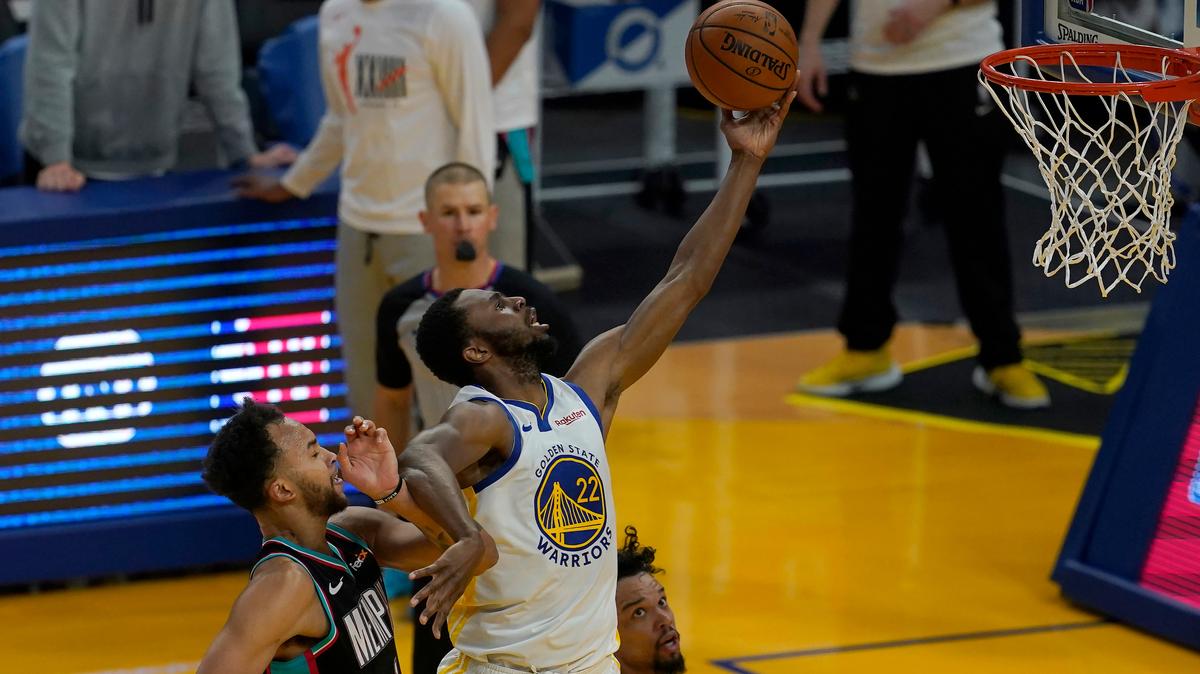 Golden State Warriors forward Andrew Wiggins (22) shoots against Memphis Grizzlies forward Kyle Anderson, left, and forward Dillon Brooks during the first half of an NBA basketball game in San Francisco, Sunday, May 16, 2021. (AP Photo/Jeff Chiu)