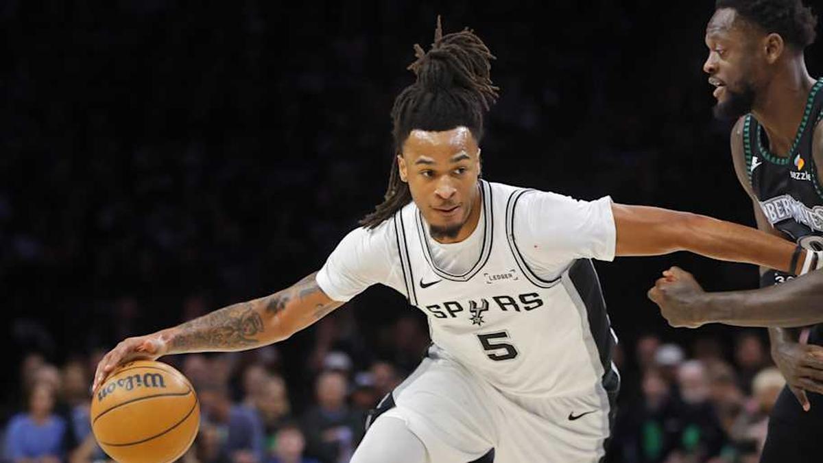  May 10, 2026; Minneapolis, Minnesota, USA; San Antonio Spurs guard Stephon Castle (5) works around Minnesota Timberwolves forward Julius Randle (30) in the first quarter of game four of the second round of the 2026 NBA Playoffs at Target Center. | Bruce Kluckhohn-Imagn Images 