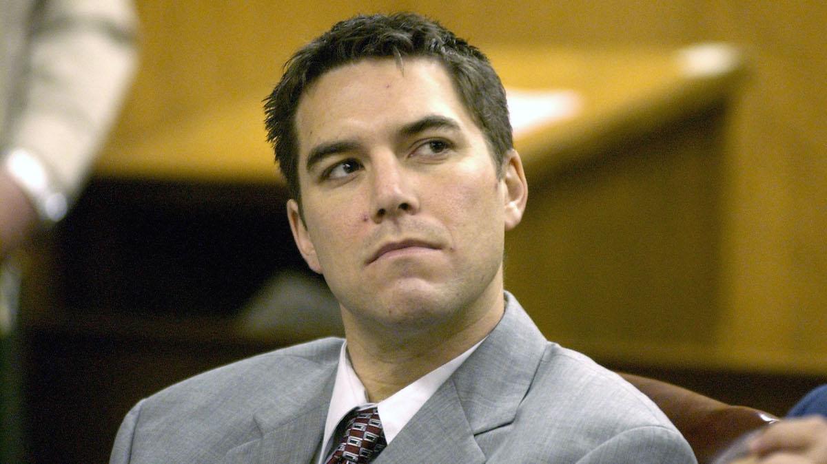 MODESTO, CA - JANUARY 14:  Scott Peterson (L) listens to prosecutor Joseph Distaso respond to defense attorney Mark Geragos' petition for dismissing double murder charges against Peterson January 14, 2004 in Modesto, California. Judge Marie Sovey Silveira denied the petition. Peterson is charged with killing his wife, Laci, and unborn son, Connor, early Christmas Eve morning in 2002.  (Photo by Bart Ah You-Pool/Getty Images)