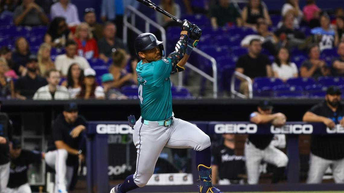 Jun 21, 2024; Miami, Florida, USA; Seattle Mariners center fielder Julio Rodriguez (44) hits an RBI single against the Miami Marlins during the first inning at loanDepot Park. Mandatory Credit: Sam Navarro-USA TODAY Sports