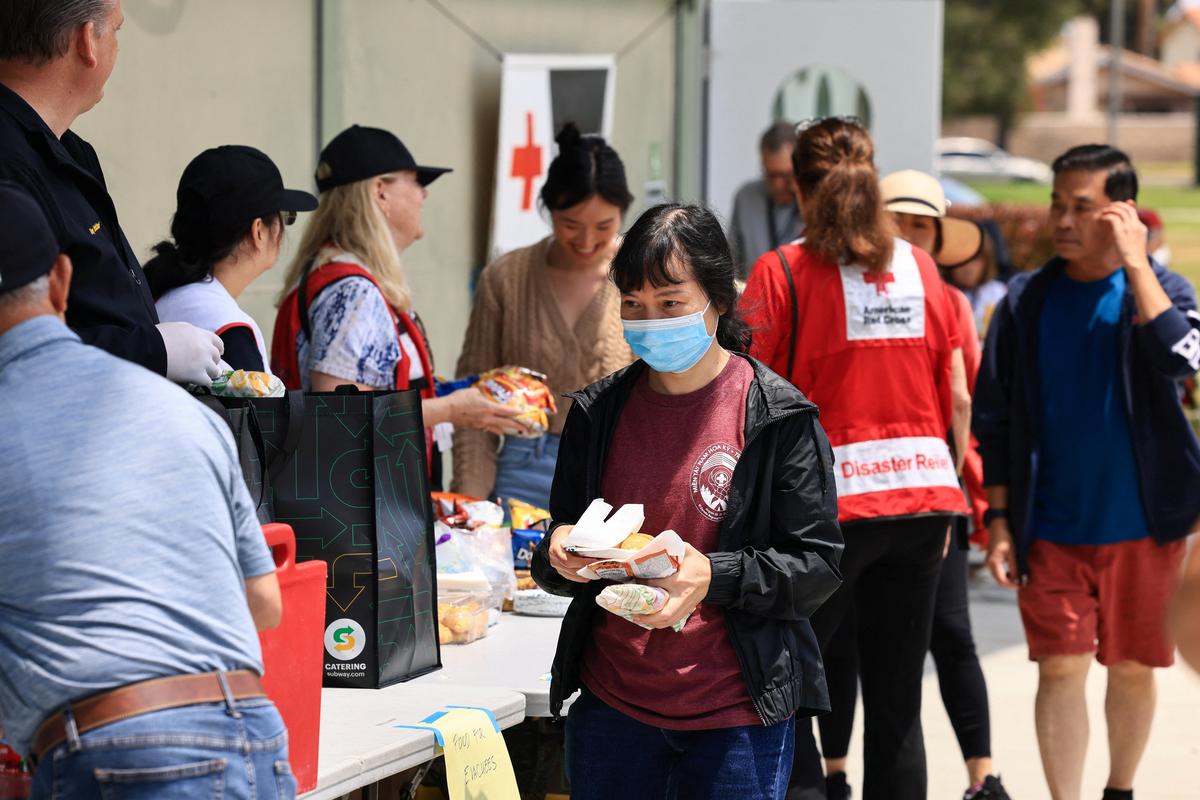 Food and beverages are distributed outside a shelter for evacuees from an area affected by a chemical incident involving a leaking tank of methyl methacrylate, a flammable liquid used in the aerospace industry, in Fountain Valley, California, U.S., May 23, 2026. The incident occurred in Garden Grove. REUTERS/David Swanson