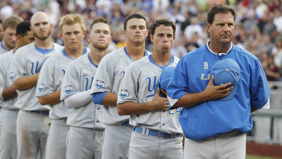  Jun 24, 2013; Omaha, NE, USA; UCLA Bruins head coach John Savage (far right) stands on the foul line with his team during the national anthem before game 1 of the College World Series finals against the Mississippi State Bulldogs at TD Ameritrade Park. Mandatory Credit: Bruce Thorson-Imagn Images | Bruce Thorson-Imagn Images 