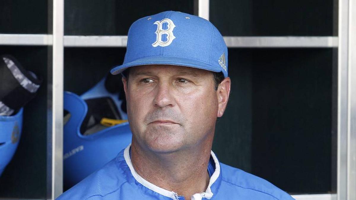  Jun 24, 2013; Omaha, NE, USA; UCLA Bruins head coach John Savage (22) looks on in the dugout before game 1 of the College World Series finals against the Mississippi State Bulldogs at TD Ameritrade Park. Mandatory Credit: Bruce Thorson-Imagn Images | Bruce Thorson-Imagn Images 