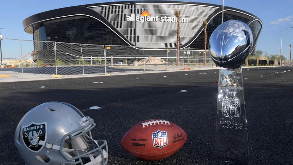  May 29, 2020; Las Vegas, Nevada, USA; General overall view of Las Vegas Raiders helmet, Wilson 2020 NFL The Duke official football and Super Bowl Vince Lombardi trophy at the Allegiant Stadium construction site. The stadium will be the home of the Las Vegas Raiders and the UNLV Rebels football teams. It is located on about 62 acres of land west of Mandalay Bay at Russell Road and Hacienda Avenue and between Polaris Avenue and Dean Martin Drive, just west of Interstate 15. Construction of the | Kirby Lee-Imagn Images 