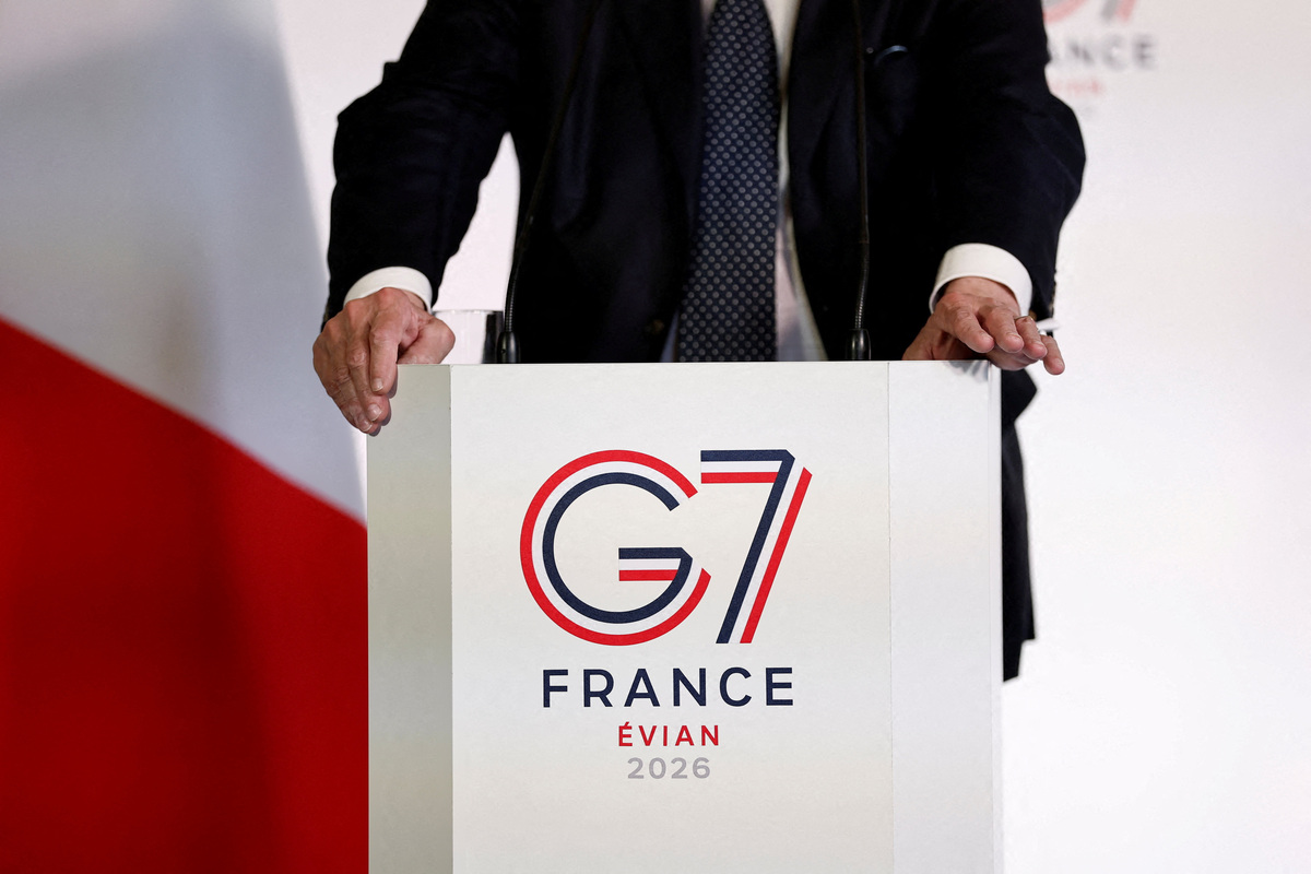 FILE PHOTO: The logo of the G7 Evian summit is seen on a desk as French Junior Minister for Foreign Trade and Attractiveness Nicolas Forissier speaks during a press conference at a meeting of G7 trade ministers in Paris, France, May 6, 2026. REUTERS/Benoit Tessier/Pool/File Photo