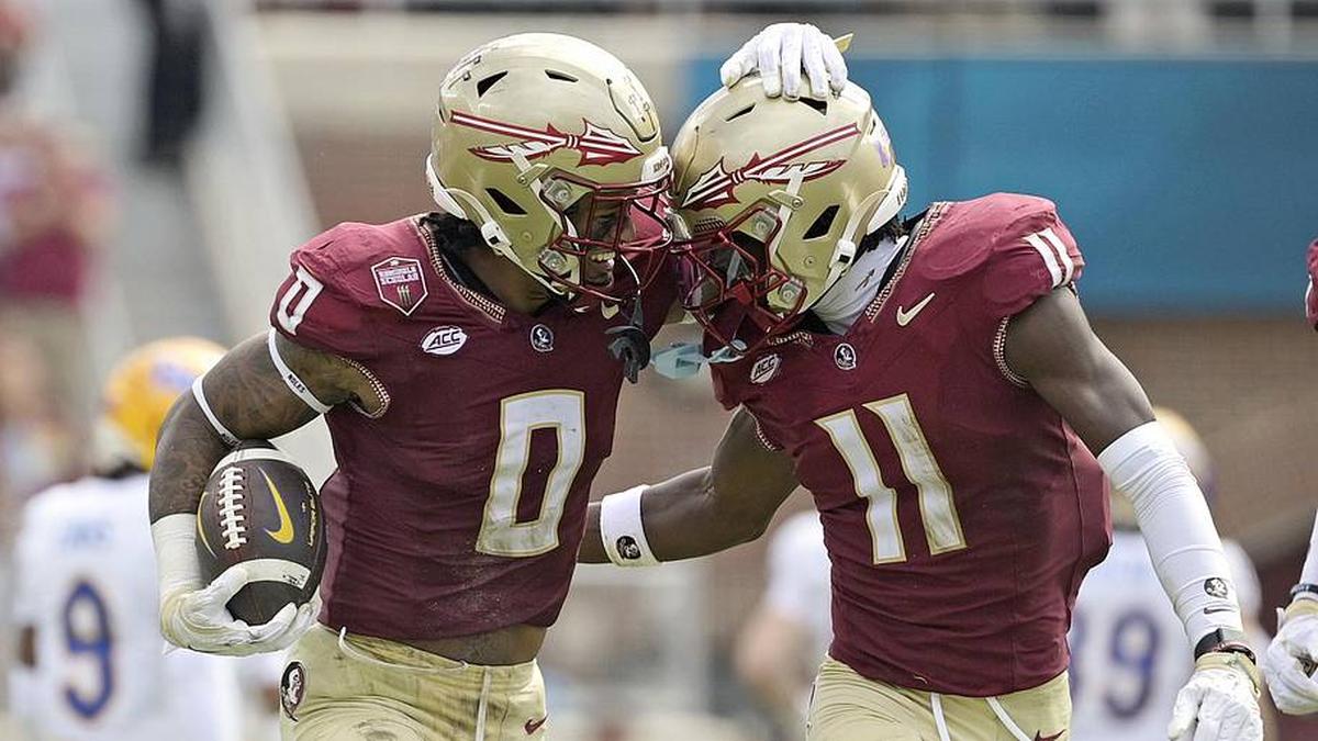  Oct 11, 2025; Tallahassee, Florida, USA; Florida State Seminoles safety Earl Little Jr. (0) and defensive back Ja'Bril Rawls (11) celebrate after an interception during the first half of the game against the Pittsburgh Panthers at Doak S. Campbell Stadium. Mandatory Credit: Melina Myers-Imagn Images | Melina Myers-Imagn Images 