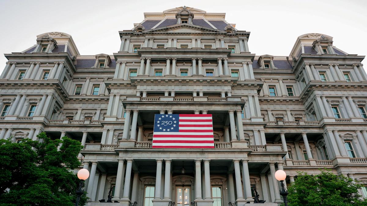 FILE PHOTO: An America250 flag decorates the Eisenhower Executive Office Building, which U.S. President Donald Trump's administration has proposed to paint white, in Washington, D.C., U.S., May 7, 2026. REUTERS/Kylie Cooper/File Photo