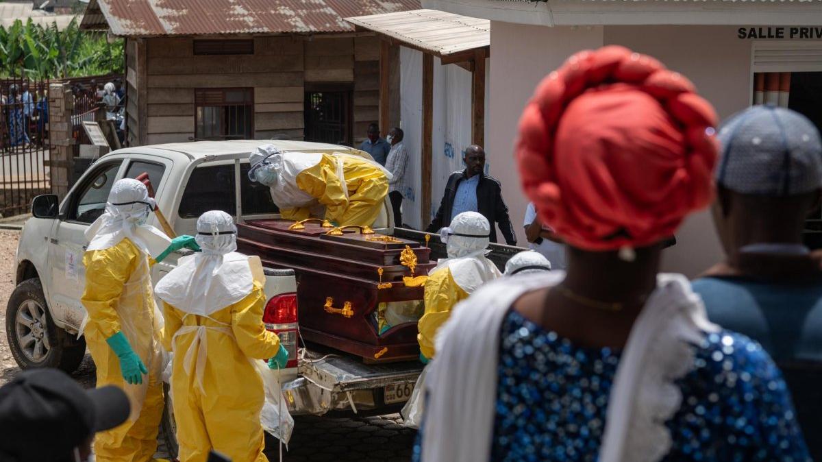 epa12987162 Health workers wearing full personal protective equipment prepare to transport the body of an Ebola victim for a safe burial at Sofepadi Hospital in Bunia, Ituri province, Democratic Republic of the Congo, on Saturday. Photo by Stringer/EPA