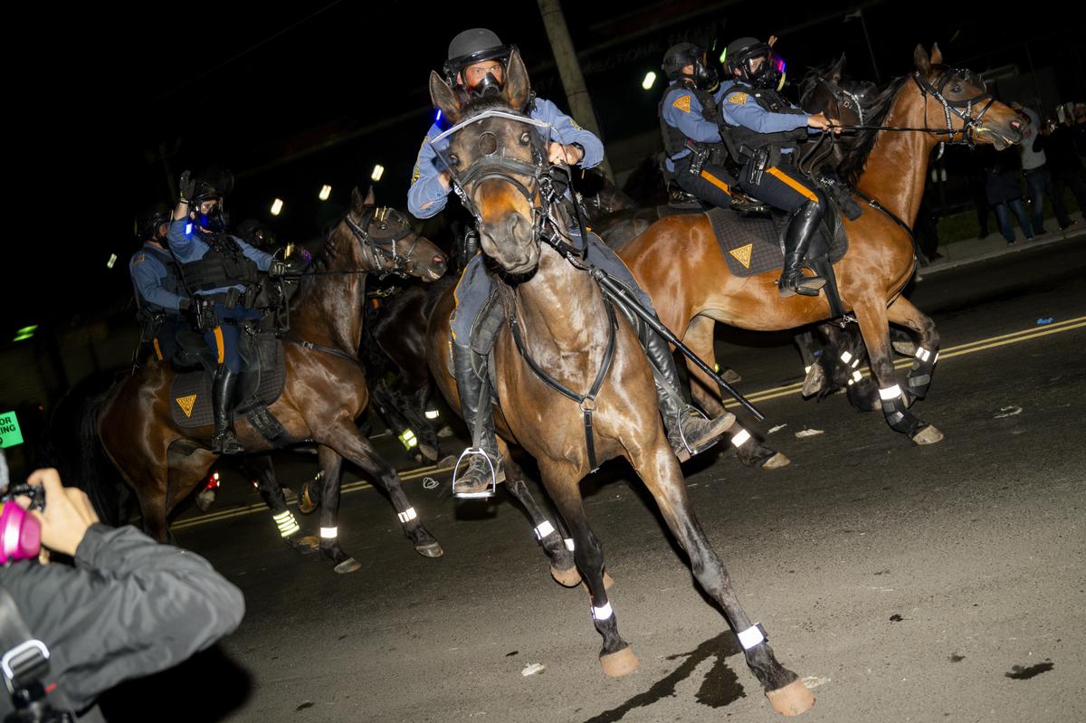 Mounted police officers monitor the anti-ICE demonstrations and counterprotests outside the Delaney Hall immigration detention center in Newark, N.J., May 30, 2026. Mayor Ras Baraka of Newark imposed a curfew early Sunday around the immigration detention center after a second consecutive night of unrest over living conditions there. (Vincent Alban/The New York Times)