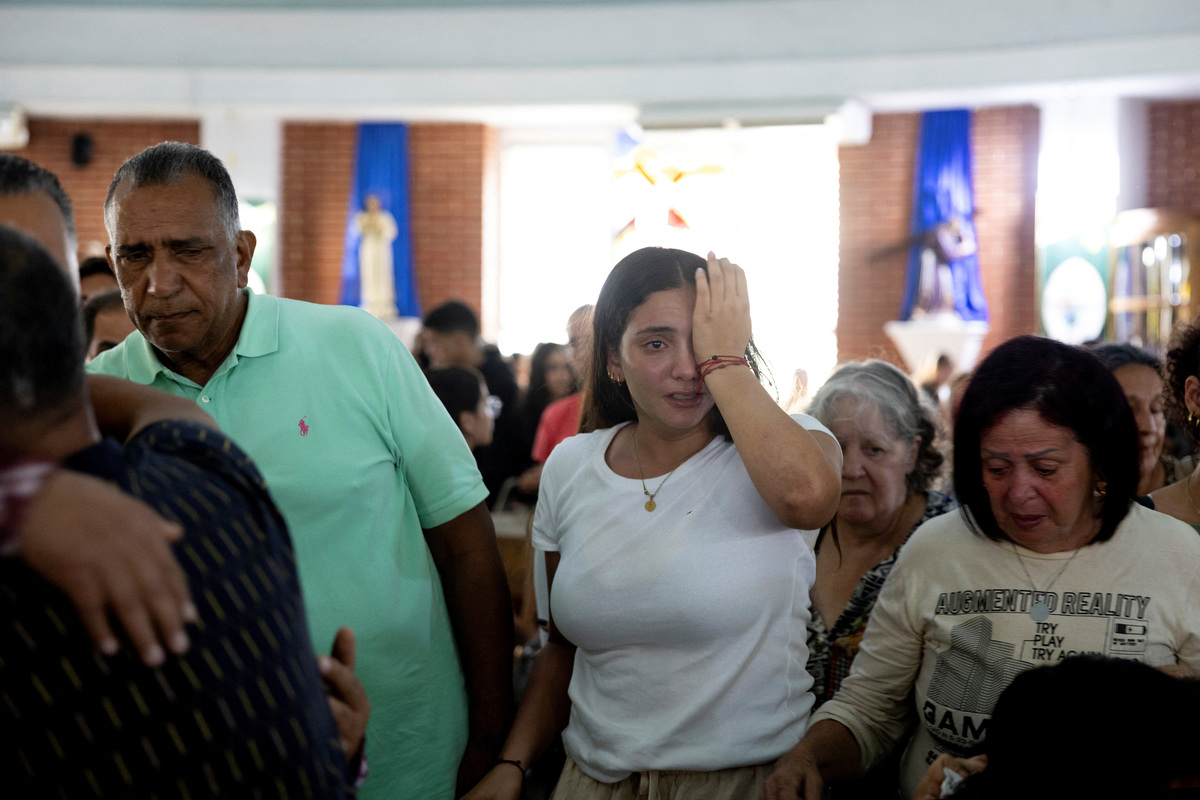 Maria Alejandra Sanz reacts after attending a memorial service for one of her friends at Maria Auxiliadora Church in Caracas, Venezuela, July 7, 2026. Sanz survived after spending 17 hours trapped beneath the rubble of her collapsed apartment building following twin earthquakes in La Guaira. REUTERS/Ricardo Arduengo