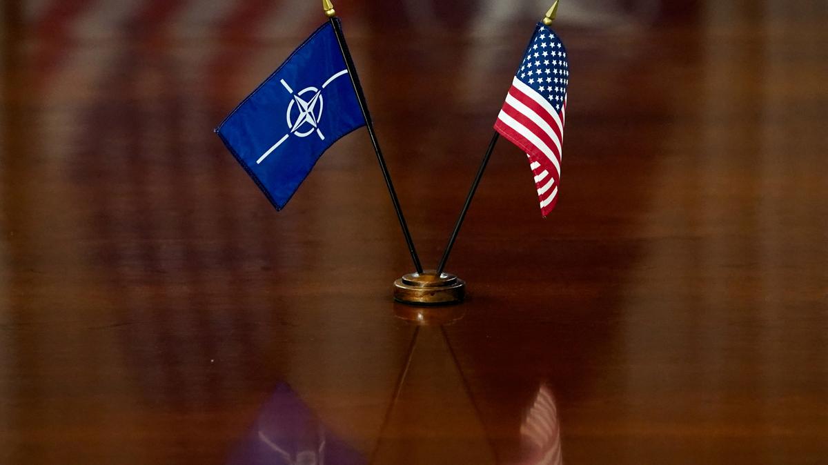 NATO and U.S. flags are set on the table as U.S. Defense Secretary Pete Hegseth and NATO Secretary General Mark Rutte meet at the Pentagon in Washington, D.C., U.S., April 24, 2025. REUTERS/Nathan Howard
