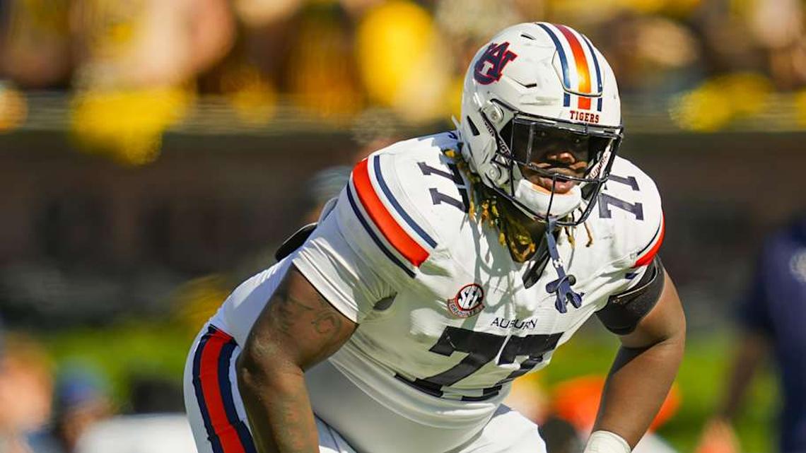  Oct 19, 2024; Columbia, Missouri, USA; Auburn Tigers offensive lineman Jeremiah Wright (77) gets ready before the snap during the second half against the Missouri Tigers at Faurot Field at Memorial Stadium. Mandatory Credit: Jay Biggerstaff-Imagn Images | Jay Biggerstaff-Imagn Images 