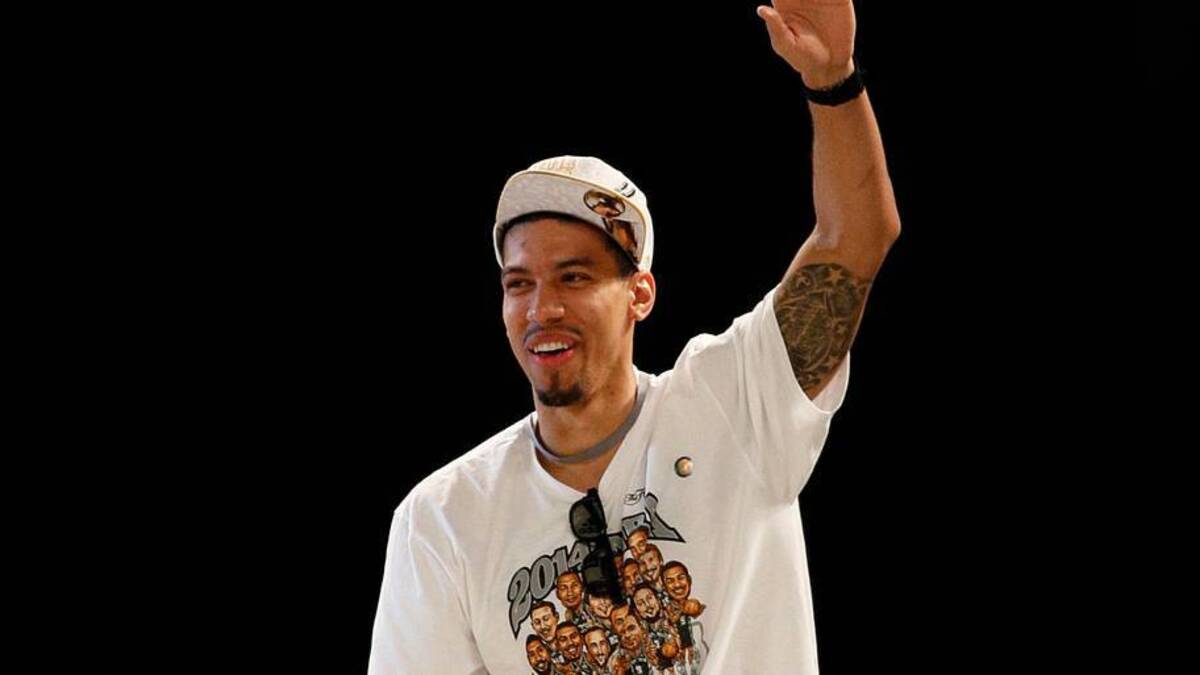  Jun 18, 2014; San Antonio, TX, USA; San Antonio Spurs guard Danny Green (4) waves to the crowd during NBA championship celebrations at Alamodome. Mandatory Credit: Soobum Im-USA TODAY Sports | IMAGN IMAGES via Reuters Connect 