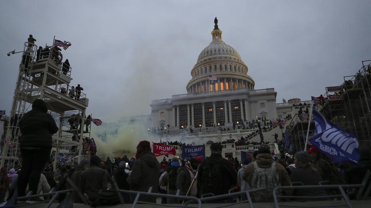 Smoke can be seen outside of the U.S. Capitol on Jan. 6, 2021, in Washington, D.C., as supporters of Donald Trump storm the building in a failed attempt to overturn the 2020 election results. (Heather Khalifa/The Philadelphia Inquirer/TNS)