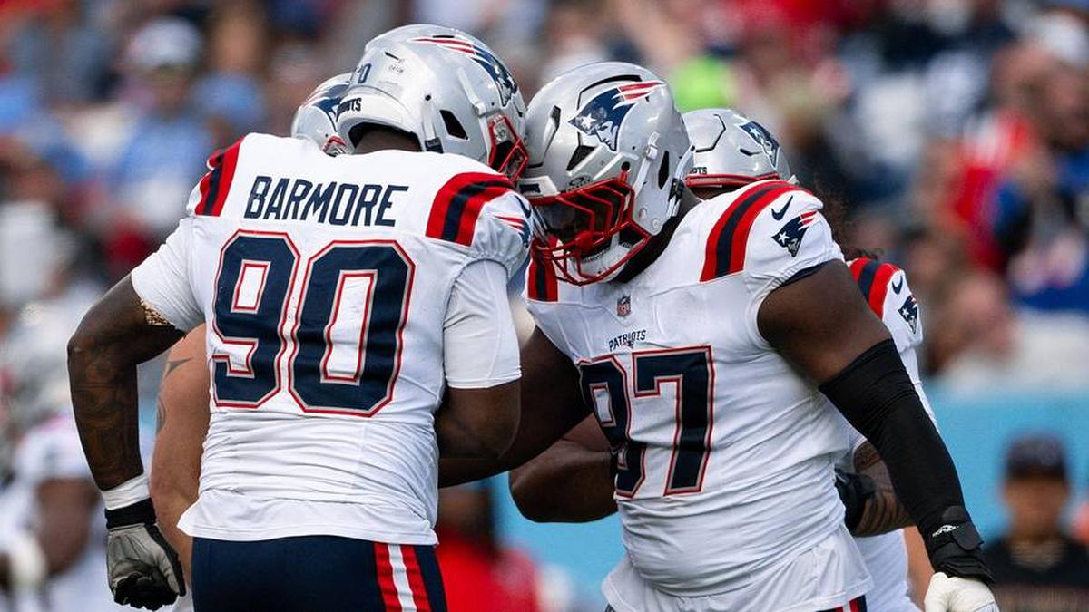  Oct 19, 2025; Nashville, Tennessee, USA; New England Patriots defensive end Milton Williams (97) celebrates the sack of Tennessee Titans quarterback Cameron Ward (1) with defensive tackle Christian Barmore (90) during the second half at Nissan Stadium. Mandatory Credit: Steve Roberts-Imagn Images | Steve Roberts-Imagn Images 