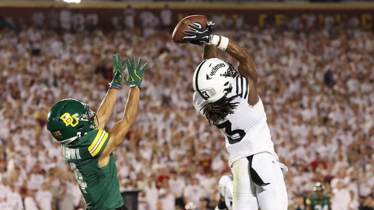  Oct 5, 2024; Ames, Iowa, USA; Iowa State Cyclones defensive back Jontez Williams (3) intercepts a pass intended for Baylor Bears wide receiver Monaray Baldwin (4) at Jack Trice Stadium. Mandatory Credit: Reese Strickland-Imagn Images | Reese Strickland-Imagn Images 
