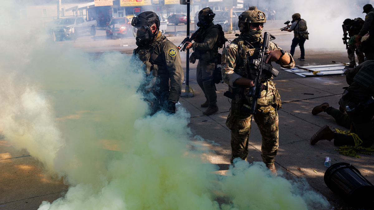 Federal officers use tear gas and smoke on members of the community and activists while they protest on South Kedzie Avenue on Oct. 4, 2025, in Chicago. (Armando L. Sanchez/Chicago Tribune/TNS)