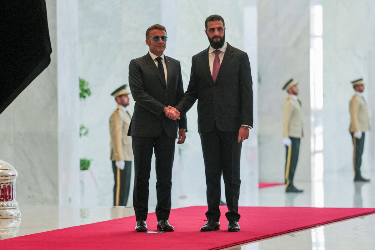 France's President Emmanuel Macron meets Syrian President Ahmed Al-Sharaa at the People's Palace in Damascus, Syria, July 7, 2026. REUTERS/Mahmoud Hassano