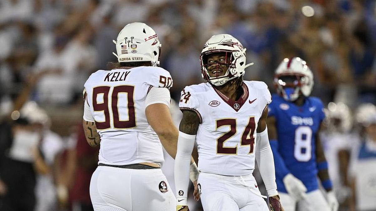  Sep 28, 2024; Dallas, Texas, USA; Florida State Seminoles defensive lineman Grady Kelly (90) and defensive back K.J. Kirkland (24) celebrate during the game between the Southern Methodist Mustangs and the Florida State Seminoles at Gerald J. Ford Stadium. Mandatory Credit: Jerome Miron-Imagn Images | Jerome Miron-Imagn Images 