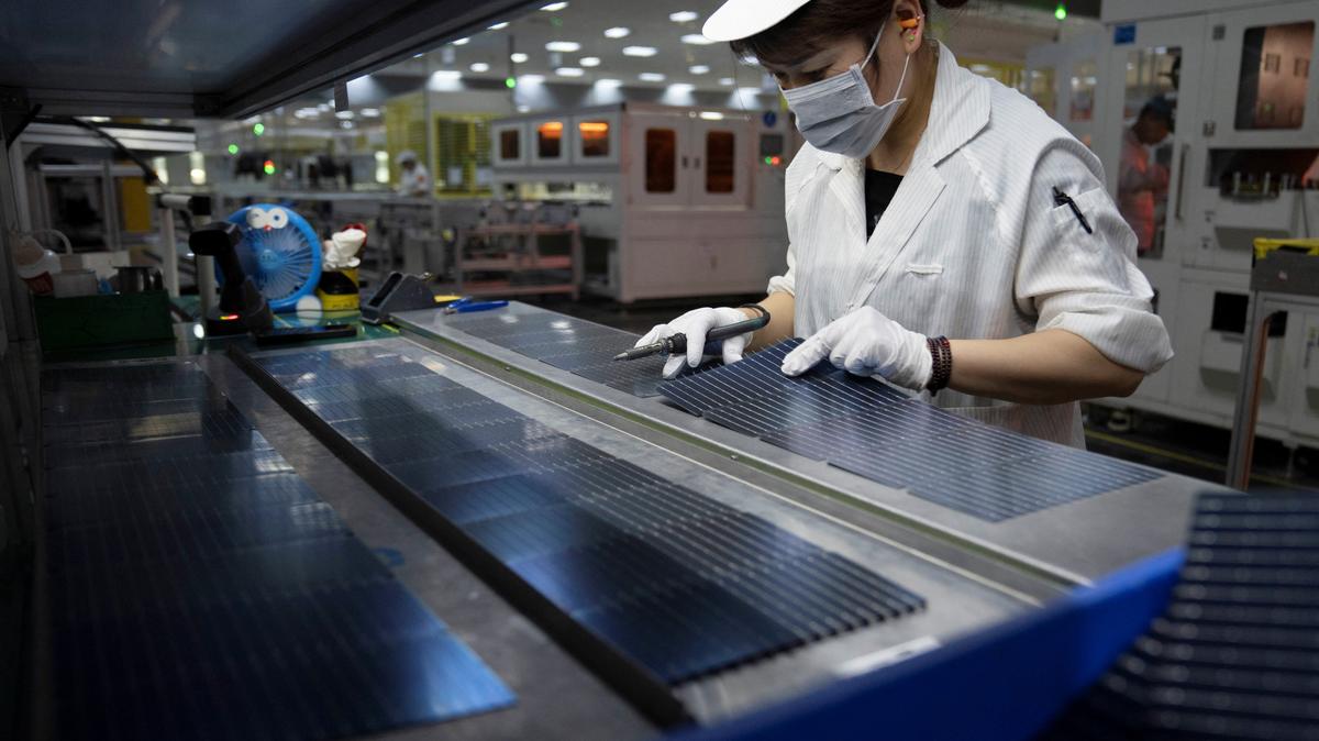 An employee works on the production line for solar panels at a factory of GCL System Integration Technology in Hefei, Anhui province, China May 16, 2024.  China Daily via REUTERS ATTENTION EDITORS - THIS PICTURE WAS PROVIDED BY A THIRD PARTY. CHINA OUT. NO COMMERCIAL OR EDITORIAL SALES IN CHINA.