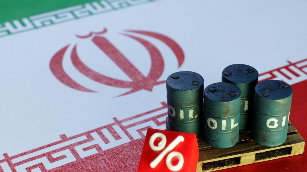 Iranian flag and 3D printed oil barrels miniature are seen in this illustration taken June 23, 2025. REUTERS/Dado Ruvic/Illustration