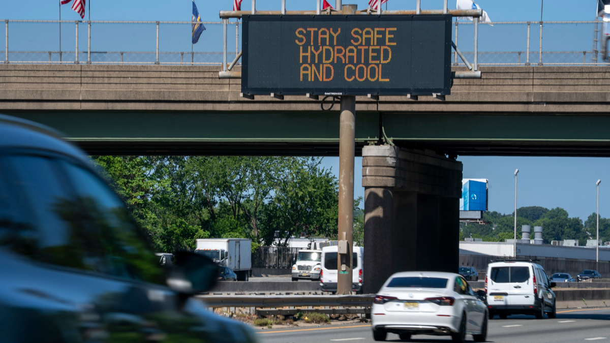 A traffic sign reminds people to stay cool in over 90-degree heat in Ridgefield Park, New Jersey, on Thursday, July 2, 2026.