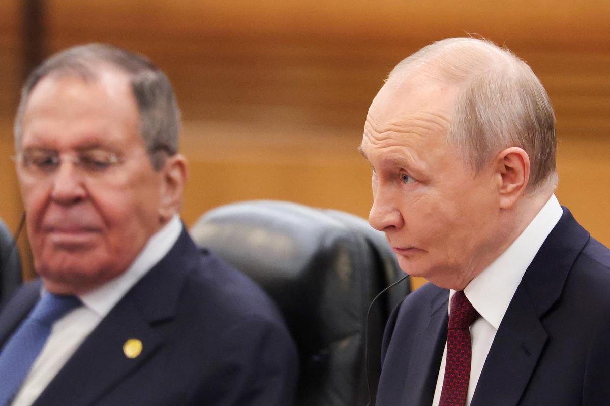 Russian President Vladimir Putin, alongside Foreign Minister Sergei Lavrov, attends a bilateral meeting with Chinese President Xi Jinping (not pictured) at the Great Hall of the People in Beijing, China May 20, 2026. REUTERS/Maxim Shemetov/Pool