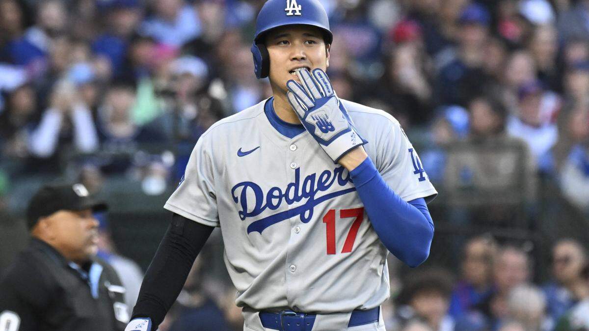 Apr 23, 2025; Chicago, Illinois, USA; Los Angeles Dodgers two-way player Shohei Ohtani (17) after running against the Chicago Cubs during the third inning at Wrigley Field. 