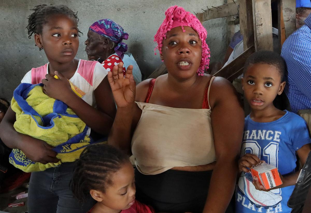 Residents rest while fleeing their homes near Cite Soleil after rival gang clashes worsened over the weekend in Haiti's capital, Port-au-Prince, Haiti, May 11, 2026. REUTERS/Fildor Pq Egeder