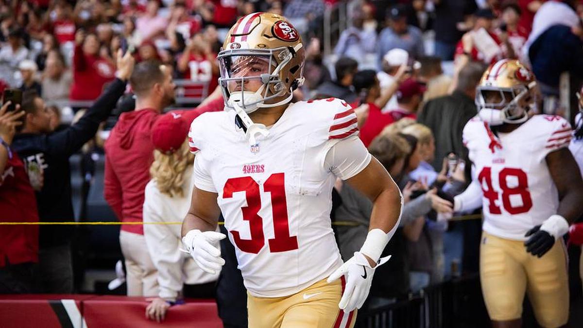  Jan 5, 2025; Glendale, Arizona, USA; San Francisco 49ers running back Isaac Guerendo (31) against the Arizona Cardinals at State Farm Stadium. Mandatory Credit: Mark J. Rebilas-Imagn Images | Mark J. Rebilas-Imagn Images 