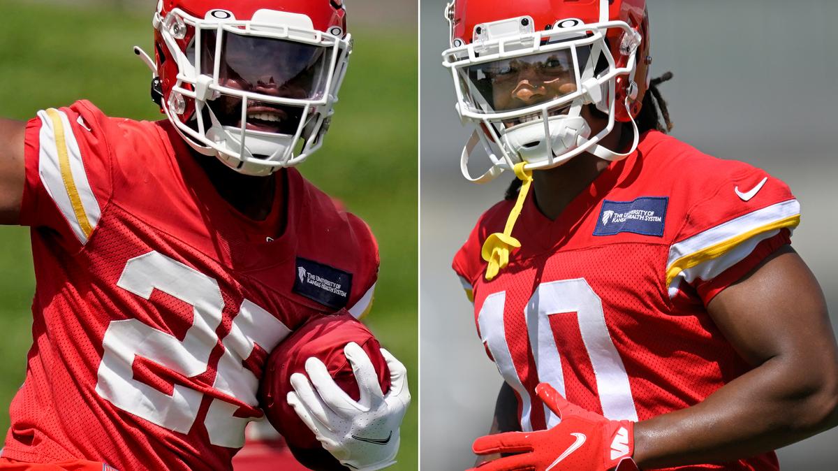 FILE - At left, Kansas City Chiefs running back Clyde Edwards-Helaire runs a drill during the NFL football team’s organized team activities Thursday, June 2, 2022, in Kansas City, Mo. At right, Chiefs running back Isiah Pacheco is shown during drills at the NFL football team’s mandatory minicamp Tuesday, June 14, 2022, in Kansas City, Mo. A third of the way through training camp, the two are in a heated race to be the starting running back of the Chiefs. (AP Photo/File)