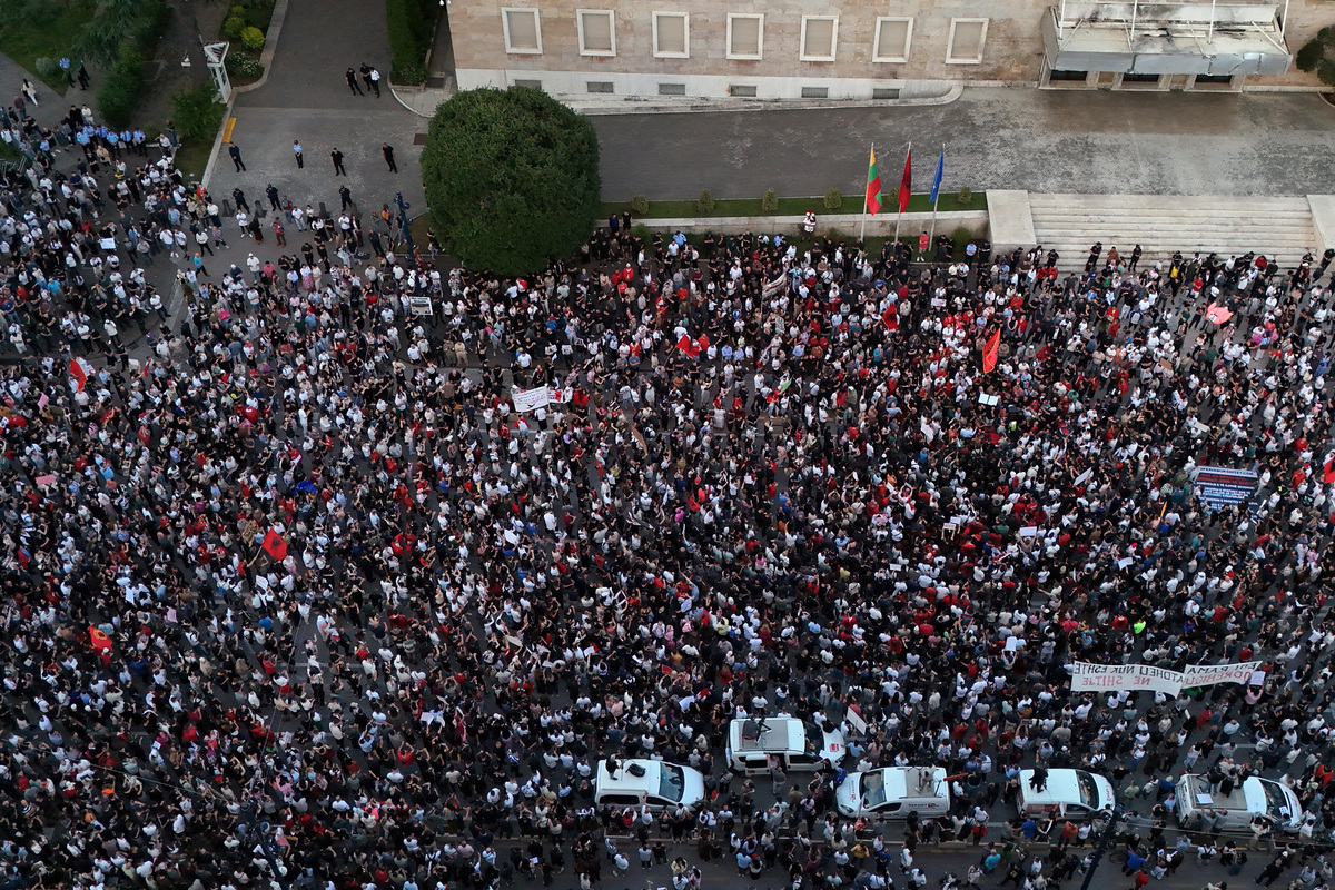 A drone view shows demonstrators holding banners during a protest against a luxury resort development planned by a company linked with Donald Trump's son-in-law, Jared Kushner, on an environmentally sensitive part of the Adriatic coast, in Tirana, Albania, June 4, 2026. REUTERS/Florion Goga