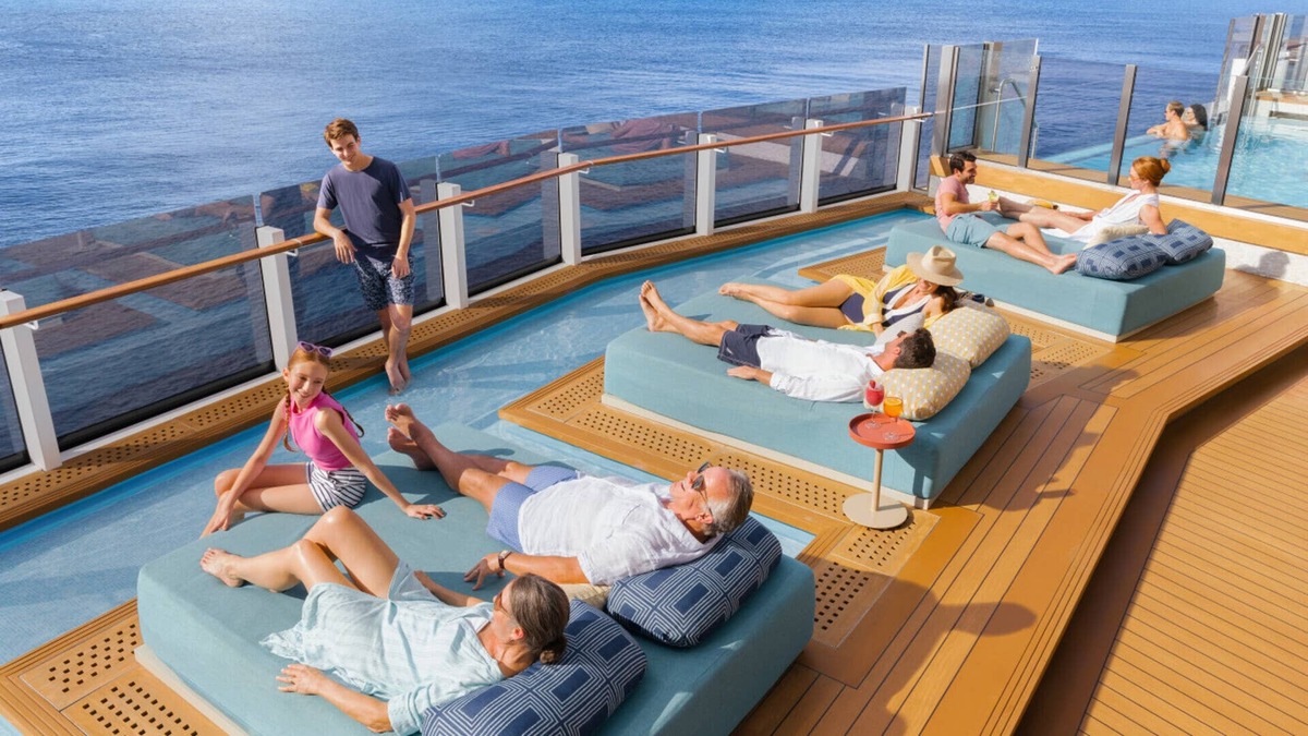 Families relax in the Infinity Beach area on the Norwegian Prima cruise ship. 