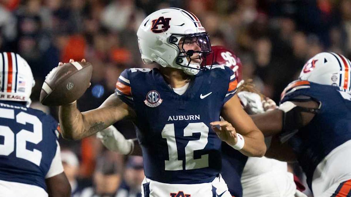  Nov 29, 2025; Auburn, Alabama, USA; Auburn quarterback Ashton Daniels (12) throws during the game with Alabama at Jordan-Hare Stadium. Mandatory Credit: Gary Cosby Jr.-Tuscaloosa News | Gary Cosby Jr.-Tuscaloosa News / USA TODAY NETWORK via Imagn Images 