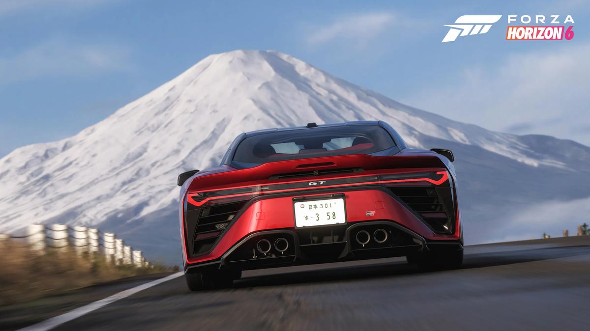 Mount Fuji looms in the background around “Forza Horizon 6” as the ToyotA GR GT races down a road. (Microsoft/TNS)