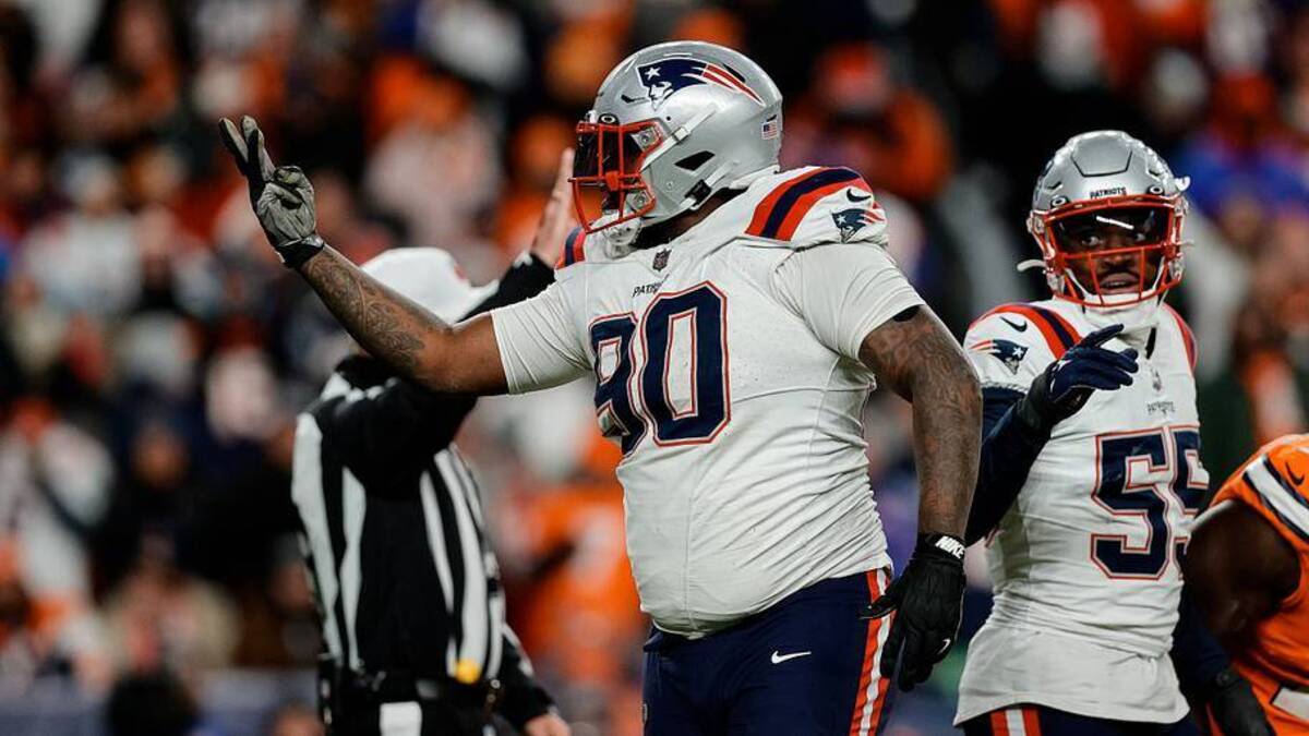  Dec 24, 2023; Denver, Colorado, USA; New England Patriots defensive tackle Christian Barmore (90) reacts after a play ]in the third quarter against the Denver Broncos at Empower Field at Mile High. Mandatory Credit: Isaiah J. Downing-USA TODAY Sports | USA TODAY Sports via Reuters Connect 