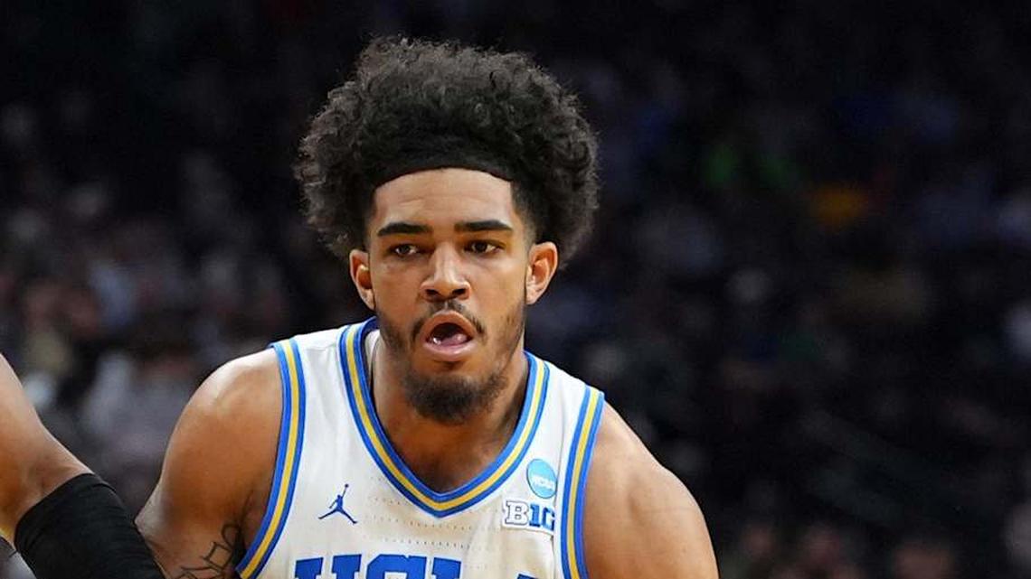  Mar 20, 2026; Philadelphia, PA, USA; UCLA Bruins guard Eric Freeny (8) dribbles the ball against UCF Knights forward Jamichael Stillwell (4) in the first half during a first round game of the men's 2026 NCAA Tournament at Xfinity Mobile Arena. Mandatory Credit: Kyle Ross-Imagn Images | Kyle Ross-Imagn Images 