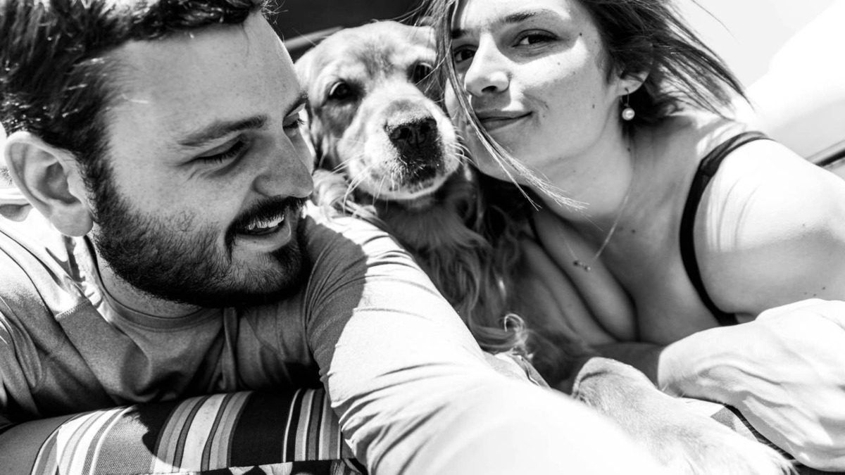 Man and woman with a dog.