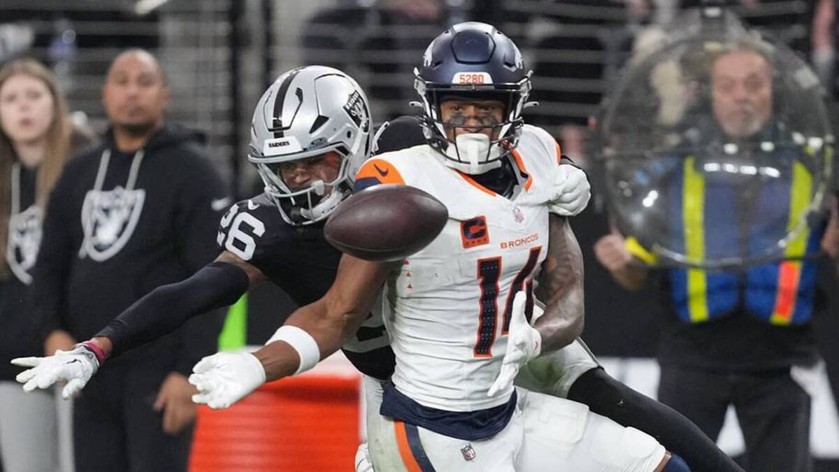  Dec 7, 2025; Paradise, Nevada, USA; Las Vegas Raiders cornerback Darien Porter (26) breaks up the pass to Denver Broncos wide receiver Courtland Sutton (14) during the second half at Allegiant Stadium. Mandatory Credit: Kirby Lee-Imagn Images | IMAGN IMAGES via Reuters Connect 