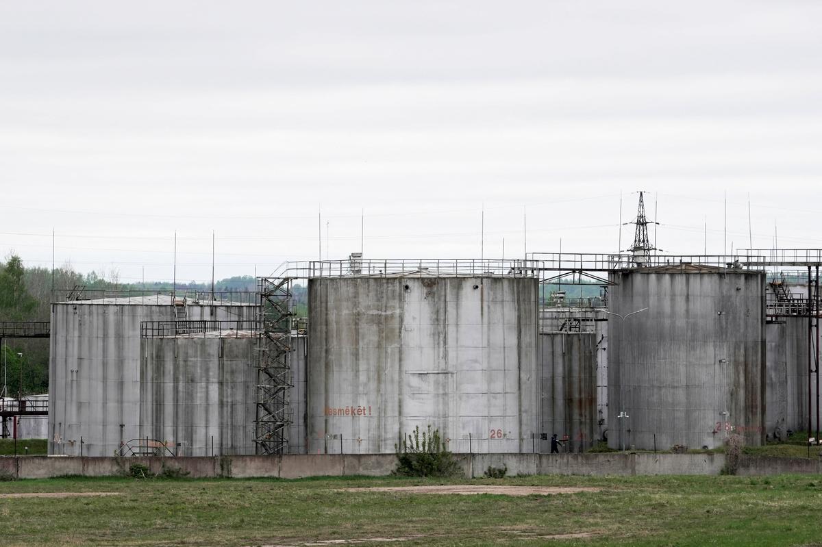 Oil tanks at the site where drones crashed at a storage facility in Rezekne, Latvia, May 7, 2026. REUTERS/Janis Laizans