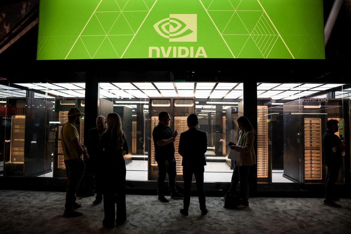 Guests tour the NVIDIA booth during the NVIDIA GTC global AI conference in San Jose, California, U.S. March 17, 2026. REUTERS/Carlos Barria