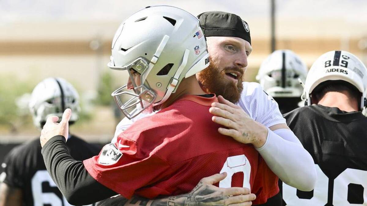  Jun 3, 2026; Henderson, NV, USA; Las Vegas Raiders defensive end Maxx Crosby (98) hugs quarterback Kirk Cousins (8) during organized team activities at Intermountain Health Performance Center. Mandatory Credit: Candice Ward-Imagn Images | Candice Ward-Imagn Images 