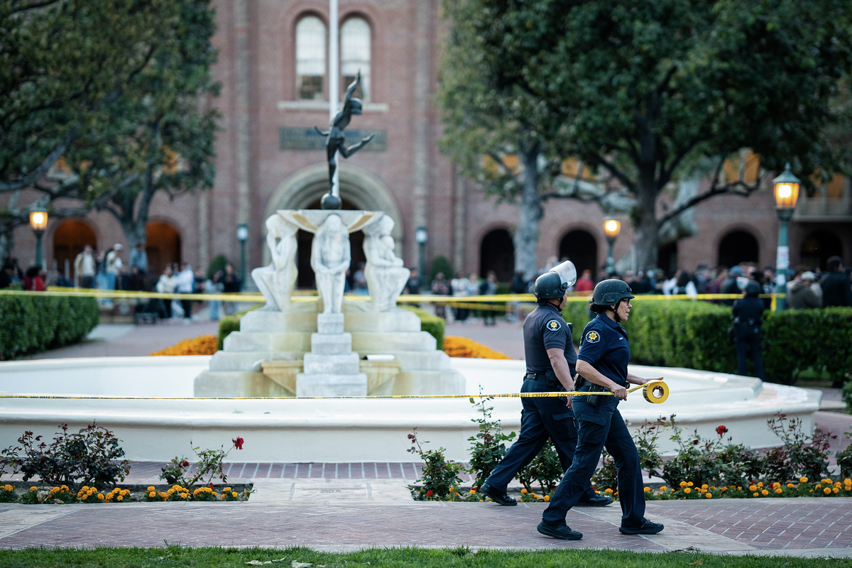  University of Sourthern California Public Safety officers tape off an area of Alumni Park during a pro-Palestinian protest on campus in Los Angeles on April 24, 2024. Photo by Jules Hotz for CalMatters 