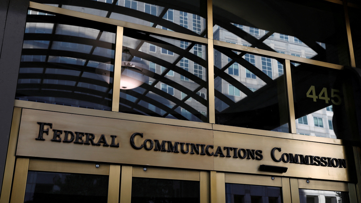 FILE PHOTO: Signage is seen at the headquarters of the Federal Communications Commission in Washington, D.C., U.S., August 29, 2020. REUTERS/Andrew Kelly/File Photo